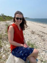 Lexi Smith on a beach, smiling